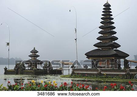 Indonesia, Bali, Bedugul, the temple of Ulun Danu is located on the shores of Lake Bratan. The Temple with its Atap Meru (bunk roofs) of 11 roofs is dedicated to the goddess of waters View Large Photo Image Stock Photograph - Indonesia, Bali, Bedugul, the temple of Ulun Danu is located on the shores of Lake Bratan. The Temple with its Atap Meru (bunk roofs) of 11 roofs is dedicated to the goddess of waters. Fotosearch