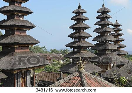 Stock Photograph - Indonesia, Bali, Besakih, landscape, temple of Besakih, dedicated to the three major Hindu deities (Brahma the creator and god of fire, Vishnu, protector and god of water, and Shiva, the destructor and god of wind), thatched roofs (meru). Fotosearch