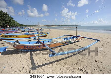 Indonesia, Bali, Denpasar, outrigger canoes on Jimbaran beach View Large Photo Image Picture - Indonesia, Bali, Denpasar, outrigger canoes on Jimbaran beach. Fotosearch