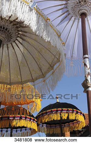 Stock Photo - Indonesia, Bali, Klunkung: Melasti ceremony (purification), parade with sunshades. Fotosearch