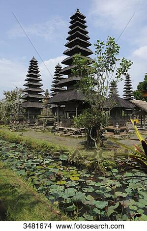 Indonesia, Bali, Mengwi, the royal temple of Taman Ayun. Taman Ayun means pretty garden. Built in the 17th Century, it is surrounded by a ditch of water. The bunk roofs are called Atap Meru. The temple is a UNESCO World Heritage site View Large Photo Image Picture - Indonesia, Bali, Mengwi, the royal temple of Taman Ayun. Taman Ayun means pretty garden. Built in the 17th Century, it is surrounded by a ditch of water. The bunk roofs are called Atap Meru. The temple is a UNESCO World Heritage site. Fotosearch