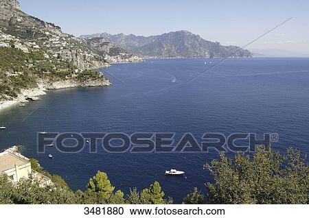 Italy, Amalfi Coast, Landscape, Panorama, Amalfi is a small Spanish-looking town whose high white houses are perched on the slopes of the hills in front of a deep blue sea. View Large Photo Image Stock Image - Italy, Amalfi Coast, Landscape, Panorama, Amalfi is a small Spanish-looking town whose high white houses are perched on the slopes of the hills in front of a deep blue sea.. Fotosearch