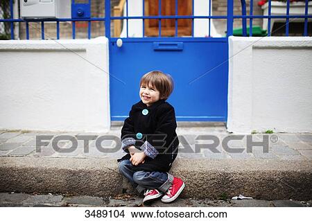 Little boy sitting on the sidewalk View Large Photo Image Picture - Little boy sitting on the sidewalk. Fotosearch