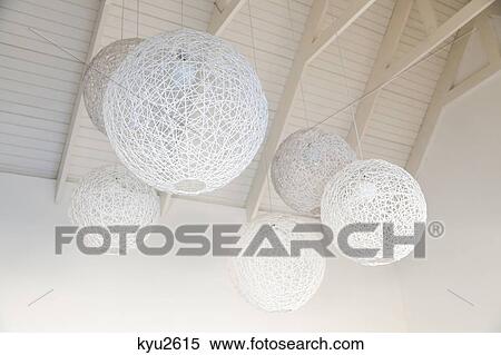 Low angle view of nest shaped lamps hanging from ceiling, South Africa View Large Photo Image Stock Photography - Low angle view of nest shaped lamps hanging from ceiling, South Africa. Fotosearch