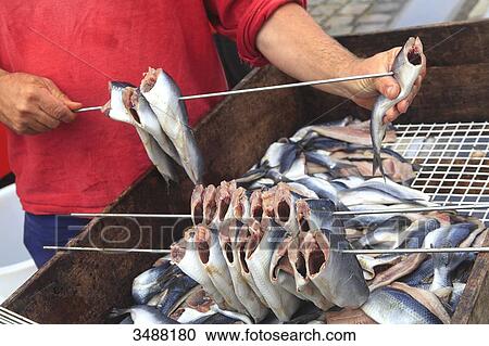 Man preparing herrings View Large Photo Image Stock Image - Man preparing herrings. Fotosearch