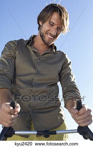 Stock Image - Man with a baby stroller. Fotosearch