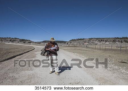 Mexico, Chihuahua State, Sierra Tarahumara, Lost hiker looking at a map View Large Photo Image Stock Image - Mexico, Chihuahua State, Sierra Tarahumara, Lost hiker looking at a map. Fotosearch