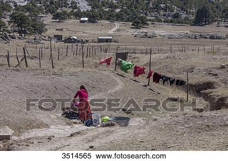 Mexico, Chihuahua State, Sierra Tarahumara, Tarahumara woman washing clothes View Large Photo Image Stock Photography - Mexico, Chihuahua State, Sierra Tarahumara, Tarahumara woman washing clothes. Fotosearch