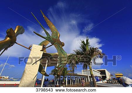Mexico, Quintana Roo, Cozumel Island. San Miguel de Cozumel. A Swallow bronze statue at the ferry dock View Large Photo Image Stock Image - Mexico, Quintana Roo, Cozumel Island. San Miguel de Cozumel. A Swallow bronze statue at the ferry dock. Fotosearch