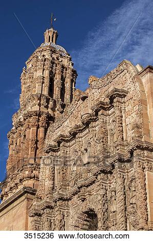 Stock Photograph - Mexico, Zacatecas state, Zacatecas, a UNESCO World Heritage. Cathedral, churrigueresque pink sandstone facade, 18th century. Fotosearch