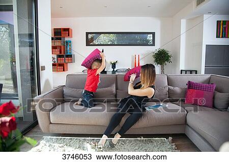 Mother and son playing on the couch View Large Photo Image Stock Image - Mother and son playing on the couch. Fotosearch