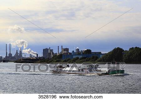 Stock Photograph - Nederlands, Ijmuiden. Canal, Tata factory, Hoogovens-Corus group.. Fotosearch
