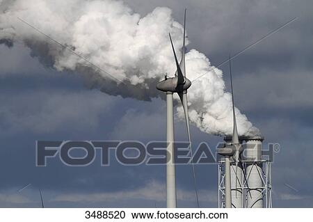 Netherlands, factory smokestack and power windmill View Large Photo Image Stock Image - Netherlands, factory smokestack and power windmill. Fotosearch