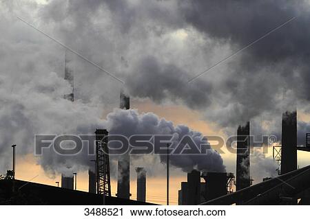 Stock Image - Netherlands, factory smokestacks. Fotosearch