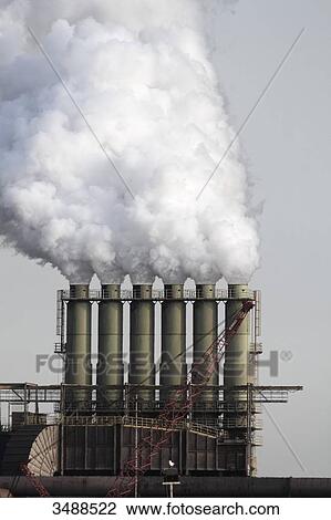 Netherlands, factory smokestacks View Large Photo Image Stock Image - Netherlands, factory smokestacks. Fotosearch