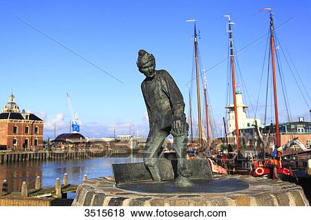 Netherlands, Friesland. Harlingen. The harbour. De Tobbedanser statue. View Large Photo Image Stock Photo - Netherlands, Friesland. Harlingen. The harbour. De Tobbedanser statue.. Fotosearch