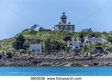 Stock Photo - Normandy, Manche, the Grande Ile Chausey, lighthouse and houses. Fotosearch