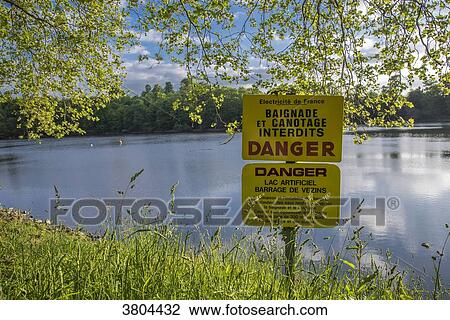 Normandy, Manche, the Mont Saint Michel Bay, forbidden sign for canoeing and bathing in the Vezins dam lake View Large Photo Image Stock Image - Normandy, Manche, the Mont Saint Michel Bay, forbidden sign for canoeing and bathing in the Vezins dam lake. Fotosearch
