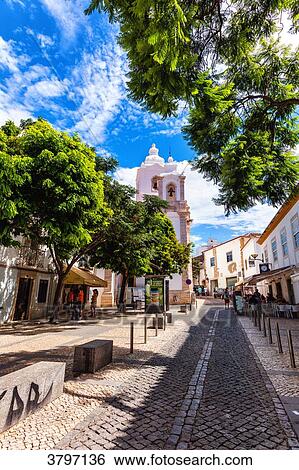 Overlooking the cobbled street and church in the town of Burgau, Algarve region, Portugal View Large Photo Image Stock Photograph - Overlooking the cobbled street and church in the town of Burgau, Algarve region, Portugal. Fotosearch