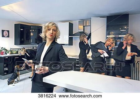 Photomontage illustrating the same woman doing several actions in her kitchen before leaving to work. View Large Photo Image Picture - Photomontage illustrating the same woman doing several actions in her kitchen before leaving to work.. Fotosearch