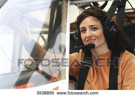 Pilot young woman in the cockpit of her microlight. View Large Photo Image Stock Photography - Pilot young woman in the cockpit of her microlight.. Fotosearch