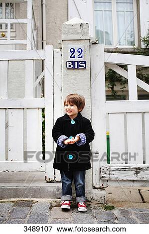 Portrait of a 4 years old boy standing in a street View Large Photo Image Stock Photo - Portrait of a 4 years old boy standing in a street. Fotosearch