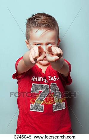 Portrait of a boy's outstretched arm pointing, looking toward the lens View Large Photo Image Stock Photography - Portrait of a boy's outstretched arm pointing, looking toward the lens. Fotosearch