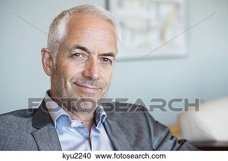 Stock Image - Portrait of a businessman smiling. Fotosearch