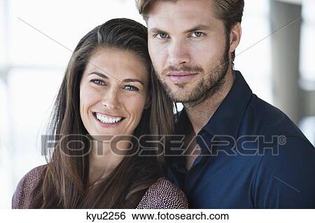 Stock Photograph - Portrait of a couple smiling. Fotosearch