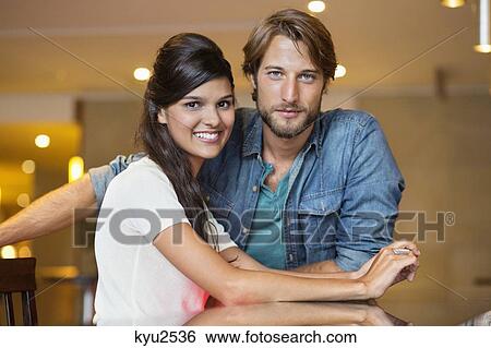 Stock Photograph - Portrait of a couple smiling. Fotosearch