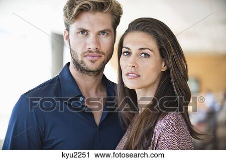 Portrait of a couple standing together View Large Photo Image Stock Image - Portrait of a couple standing together. Fotosearch