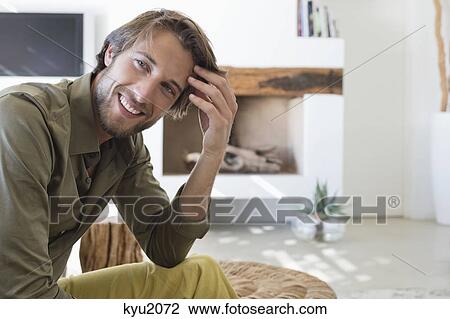 Stock Image - Portrait of a man smiling. Fotosearch