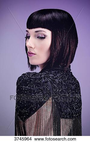 Portrait of a sensual young woman in profile, wearing a high Bolongaro Trevor View Large Photo Image Picture - Portrait of a sensual young woman in profile, wearing a high Bolongaro Trevor. Fotosearch