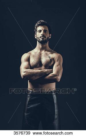 Portrait of a shirtless man with arms crossed View Large Photo Image Stock Photo - Portrait of a shirtless man with arms crossed. Fotosearch