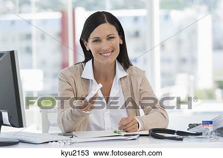 Portrait of a smiling receptionist in a doctor's office View Large Photo Image Stock Image - Portrait of a smiling receptionist in a doctor's office. Fotosearch