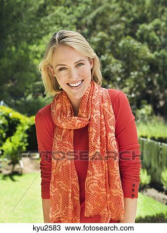 Portrait of a smiling woman posing View Large Photo Image Stock Image - Portrait of a smiling woman posing. Fotosearch