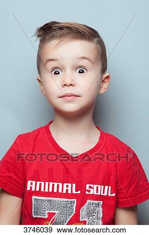 Portrait of a surprised boy, looking toward the lens View Large Photo Image Stock Photo - Portrait of a surprised boy, looking toward the lens. Fotosearch