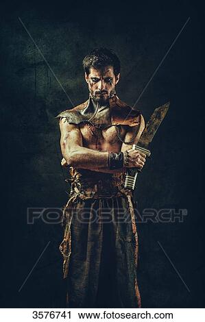 Portrait of a tribal warrior standing arms crossed View Large Photo Image Stock Image - Portrait of a tribal warrior standing arms crossed. Fotosearch