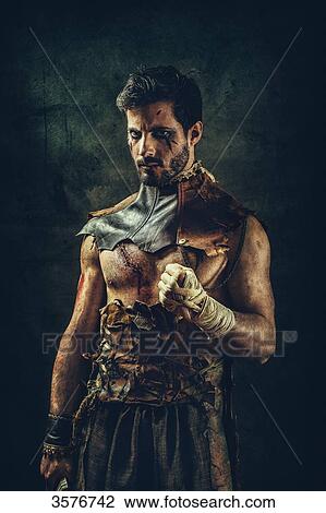 Portrait of a tribal warrior standing clenched fist View Large Photo Image Stock Image - Portrait of a tribal warrior standing clenched fist. Fotosearch