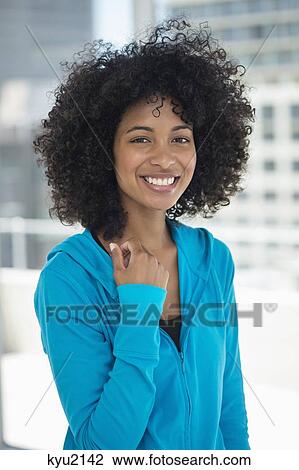 Stock Image - Portrait of a woman smiling. Fotosearch