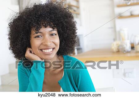 Portrait of a woman smiling View Large Photo Image Stock Photo - Portrait of a woman smiling. Fotosearch