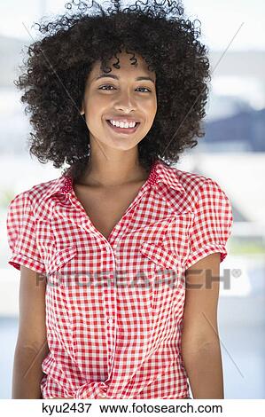 Stock Photo - Portrait of a woman smiling. Fotosearch