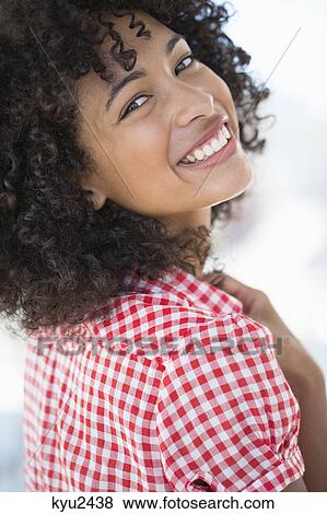 Portrait of a woman smiling View Large Photo Image Stock Photo - Portrait of a woman smiling. Fotosearch