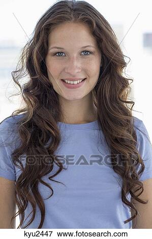 Stock Photo - Portrait of a woman smiling. Fotosearch