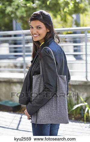 Stock Photo - Portrait of a woman smiling. Fotosearch