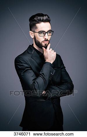 Portrait of a young businessman pensive View Large Photo Image Stock Image - Portrait of a young businessman pensive. Fotosearch