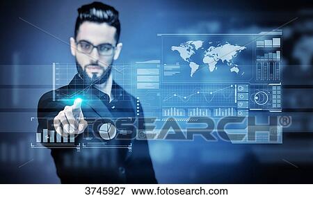 Portrait of a young Businessman touching a virtual screen View Large Photo Image Stock Photo - Portrait of a young Businessman touching a virtual screen. Fotosearch