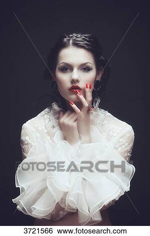 Portrait of a young girl with a lace top with frill Burlesque, hand on cheek View Large Photo Image Stock Photograph - Portrait of a young girl with a lace top with frill Burlesque, hand on cheek. Fotosearch