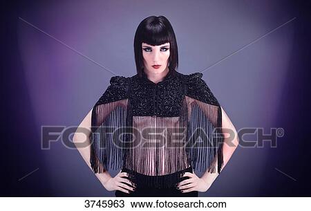 Portrait of a young woman face, hands on hips, wearing a high Bolongaro Trevor View Large Photo Image Stock Image - Portrait of a young woman face, hands on hips, wearing a high Bolongaro Trevor. Fotosearch