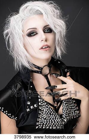 Portrait of a young woman glam-rock with white hair, looking towards the camera View Large Photo Image Stock Photography - Portrait of a young woman glam-rock with white hair, looking towards the camera. Fotosearch